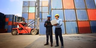engineer-or-supervisor-checking-and-control-loading-containers-box-from-cargo-at-harbor-foreman_t20_G0lKd6